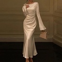 An elegant, modern women’s dress that reflects a refined personality