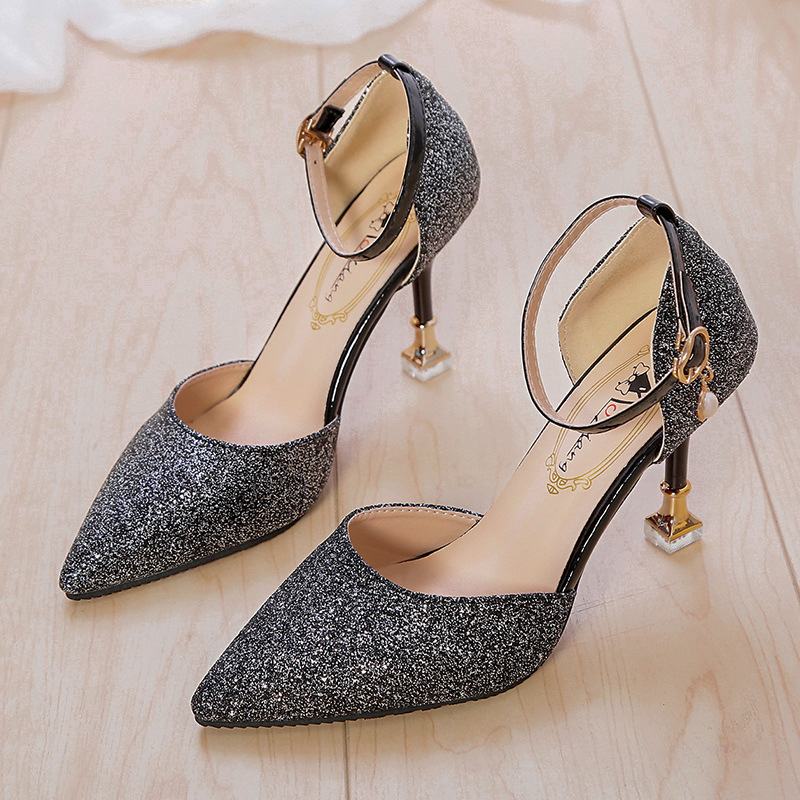 A high-heeled, pointed-toe shoe with a low-cut vamp and sparkling sequins