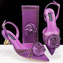 A set featuring a high‑heeled shoe and a satin bag adorned with flowers and rhinestones