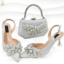 A women’s set featuring handmade shoes and a bag, adorned with leaf motifs and elegant details