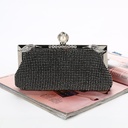 Women's luxury evening bag adorned with diamonds and an elegant chain