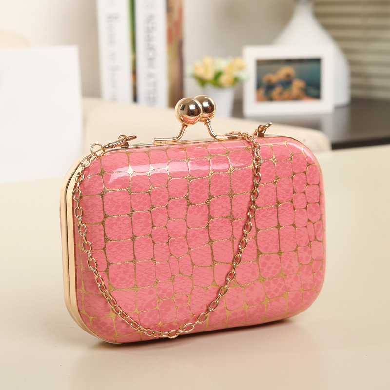 Mini beaded bag adorned with rhinestones, featuring an elegant double clip design