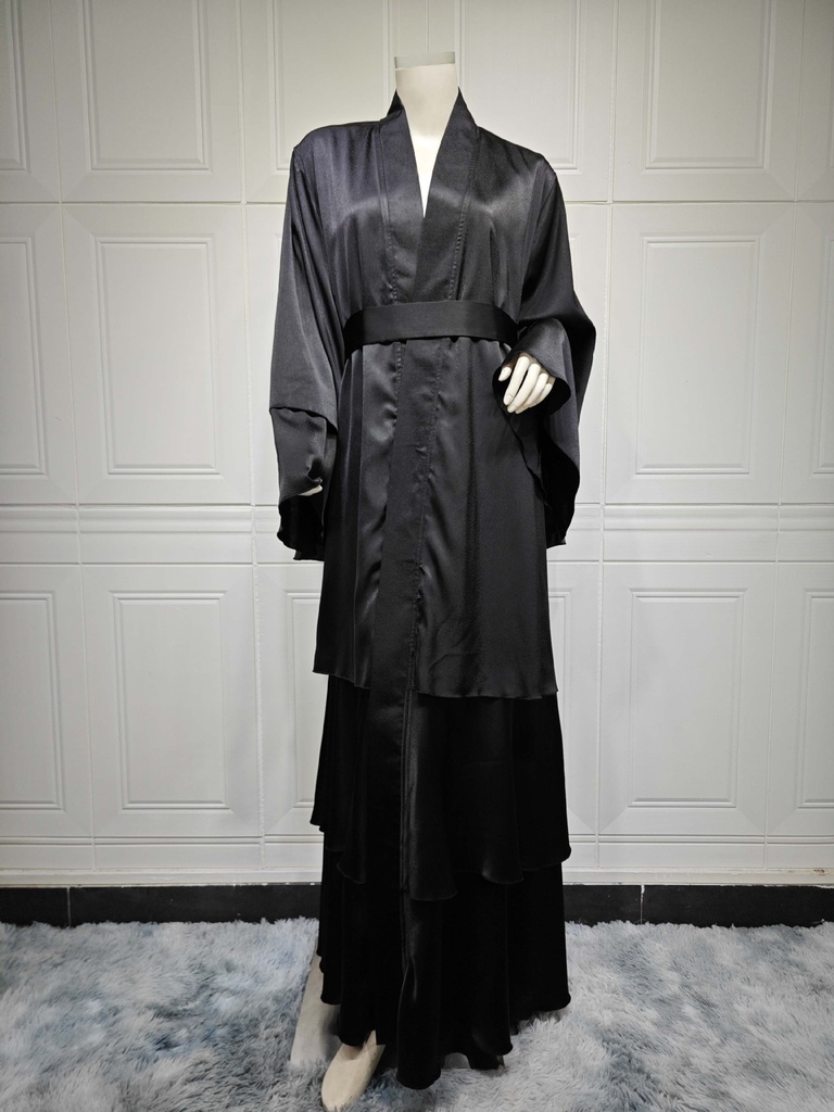 An elegant and modern abaya in a solid color, with an outer cardigan 