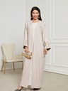 An embroidered cardigan dress with an elegant and modern design.