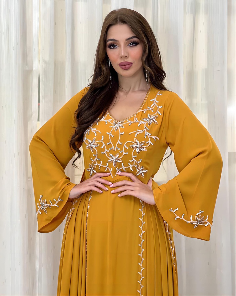 A luxurious dress with elegant embroidery inspired by Islamic style, combining sophistication and grace 