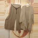 طقم نسائي من كنزة طويلة وبنطلون مخطط مكون من قطعتين