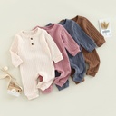 A multicolored knitted romper for children, showcasing a distinctive elegance and modern style 