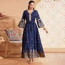 An elegant and luxurious long-sleeve dress with exquisite bronzing details, designed to combine sophistication and modesty