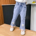 Girls' jeans with a Korean-style wide-leg design, made from comfortable stretch fabric and adorned with elegant feminine details like a bow — offering a modern and practical look