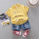 Trendy children's outfit with a unique design – cartoon character print shirt paired with stylish shorts for a bold and playful look