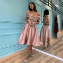 Elegant and feminine women's long dress with a simple off-shoulder design, embellished with sequins for a stylish and eye-catching look