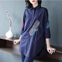 Elegant and modern women's blouse with a mid-length design