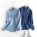 Elegant women's denim shirt with long sleeves, made of lightweight fabric and featuring a slim fit design