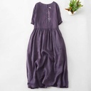 Elegant dress with short sleeves and a modern below-the-knee design
