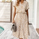 Elegant women's dress featuring a distinctive print and an adjustable drawstring waist