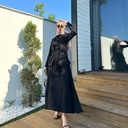 Elegant women's suit with long sleeves and a stylish front tie