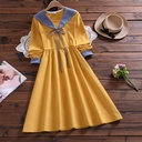 Loose-fitting women's dress with long sleeves and an elegant collar