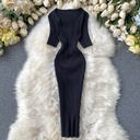 Knitted bodycon dress in solid color with a V-neckline and ribbed stripe texture for a sleek, modern look