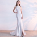 An enchanting mermaid-cut dress with an elegant halter neckline that beautifully exposes the shoulders