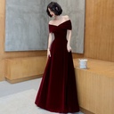 An off-shoulder evening dress that adds an elegant feminine touch