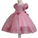 A girls’ dress crafted with exquisite taste, its elegance evident in every detail