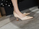 Leather stiletto heels adorned with pearls, featuring a pointed toe and single strap