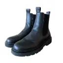 Men's high-top leather boots with a thick sole, featuring a modern design that adds a stylish and elevated look