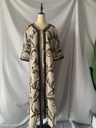 An elegant and distinctive kaftan dress embroidered with a design inspired by Islamic heritage fashion 